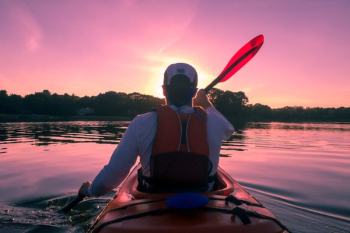 man riding on kayak man riding on kayak