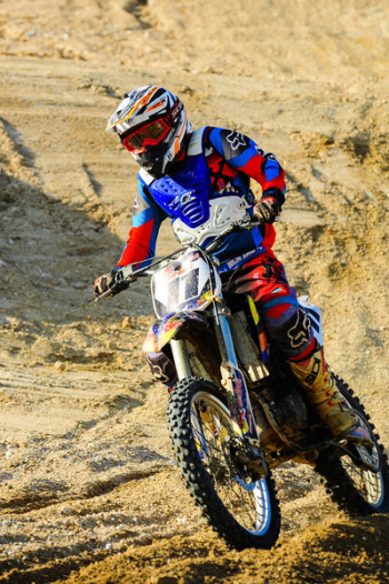 Man Riding on Motocross Dirt Bike Man Riding on Motocross Dirt Bike
