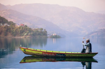 man riding yellow boat man riding yellow boat