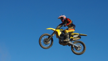 Man Riding Yellow Motocross Dirt Bike Man Riding Yellow Motocross Dirt Bike