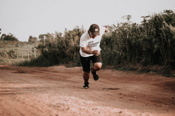 Man Running on Dirt Road Man Running on Dirt Road