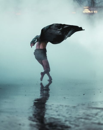 Man runs gracefully through fog and rain in Tate Modern Man runs gracefully through fog and rain in Tate Modern