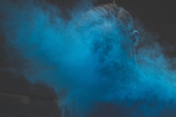 man's face covered with smoke man's face covered with smoke
