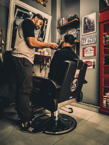 Man Shaving Another Man&#39;s Beard