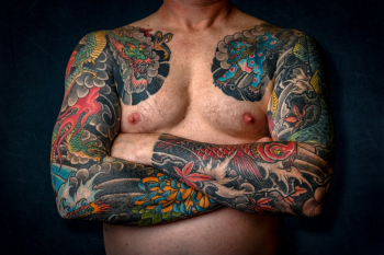 Man Showing His Arm Tattoos Man Showing His Arm Tattoos