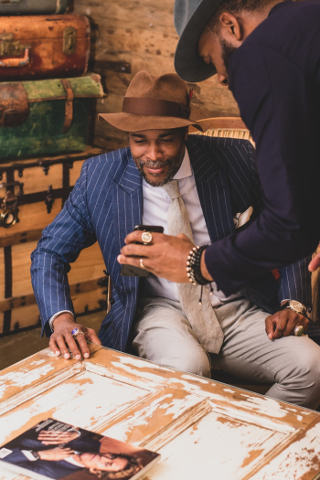 Man Showing Smartphone To Another Man Man Showing Smartphone To Another Man