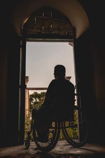 Man Sits on Wheelchair Man Sits on Wheelchair