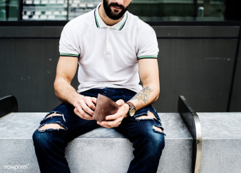 Man sitting checking his money | Free stock photo - 388243