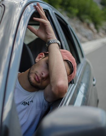 man sitting inside car man sitting inside car