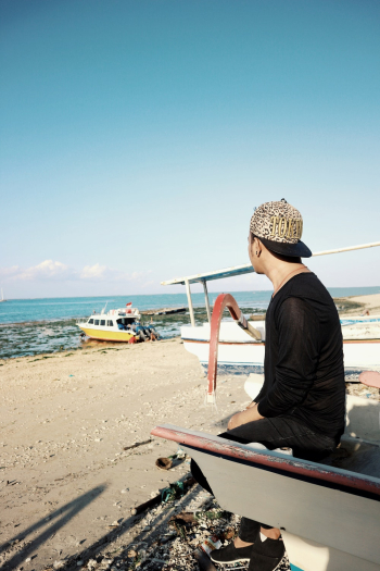 Man Sitting On A Boat Man Sitting On A Boat