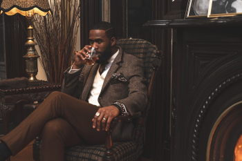 Man Sitting on Armchair Man Sitting on Armchair