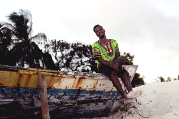 Man Sitting On Boat Man Sitting On Boat