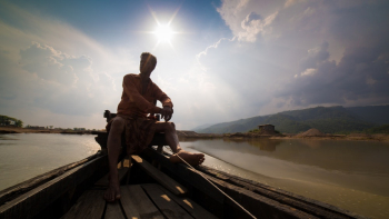 Man Sitting on Boat Man Sitting on Boat