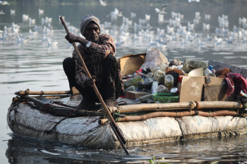 Man Sitting on Boat Man Sitting on Boat
