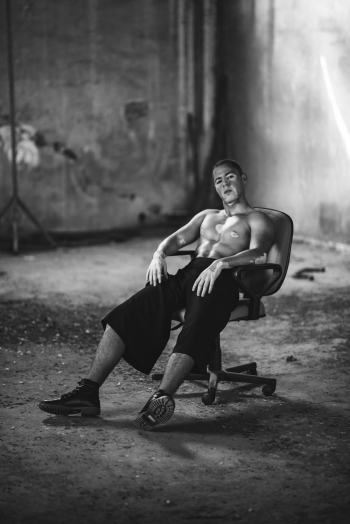 Man Sitting On Office Chair Man Sitting On Office Chair