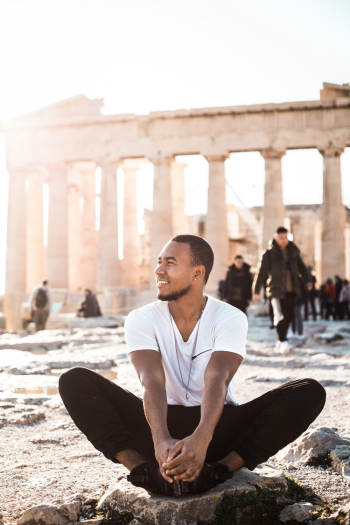 Man Sitting on Rock Man Sitting on Rock