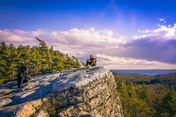 Man Sitting on the Edge of Cliff