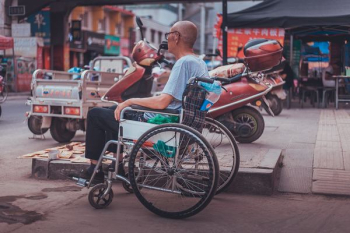 man sitting on wheelchair man sitting on wheelchair