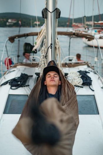 man sleeping on boat hammock man sleeping on boat hammock