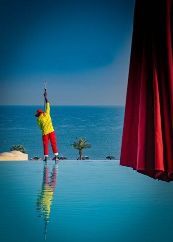 Man Standing Beside Pool