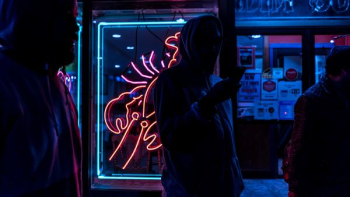 man standing holding smartphone man standing holding smartphone
