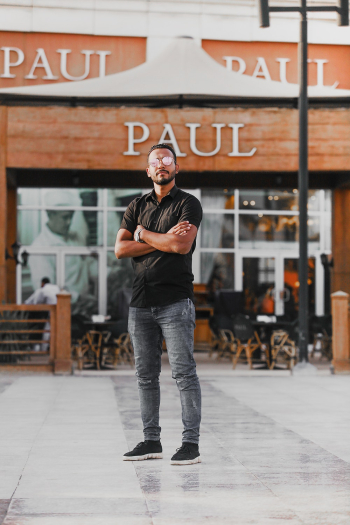 Man Standing Near Paul Building Man Standing Near Paul Building