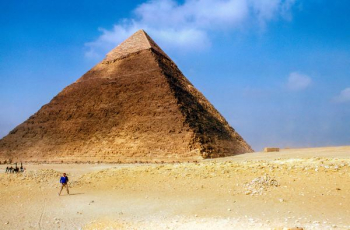 man standing near Pyramid Giza during daytime man standing near Pyramid Giza during daytime