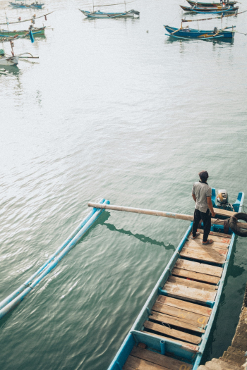 Man Standing On Boat Man Standing On Boat