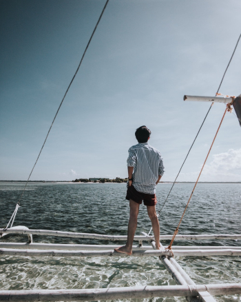 Man Standing on Boat Man Standing on Boat