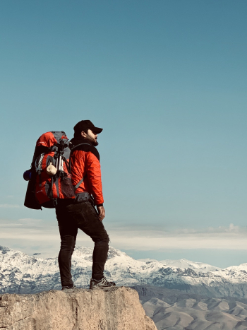 Man Standing on Cliff Edge