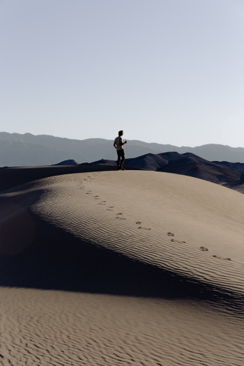 Man Standing on Sand dunes Man Standing on Sand dunes