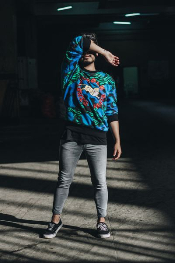 man standing while wearing jacket and denim jeans man standing while wearing jacket and denim jeans