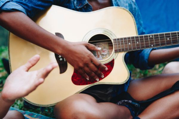 man strumming guitar man strumming guitar
