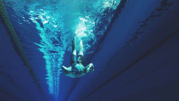 man swimming in swimming pool man swimming in swimming pool