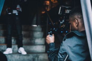 man taking photo of another man man taking photo of another man