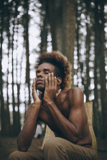 Man Touching His Face