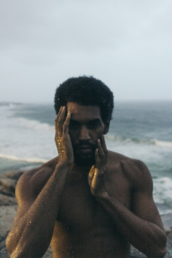 Man Touching His Face