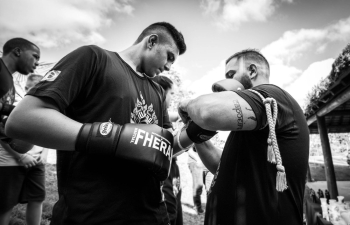 Man Tying Up Gloves on Boxer Man Tying Up Gloves on Boxer