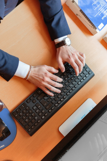 Man Typing on Computer Keyboard Man Typing on Computer Keyboard