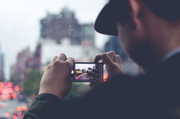 man using the smartphone camera man using the smartphone camera