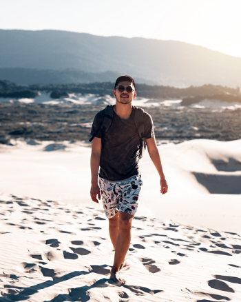 Man Walking Barefoot on Sand Man Walking Barefoot on Sand