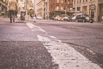 Man Walking on Grey Asphalt Road Man Walking on Grey Asphalt Road