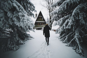 man walking on snow man walking on snow