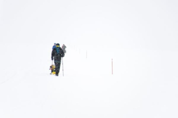 man walking on snow land man walking on snow land