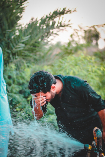 Man Washing His Face