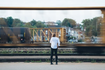 Man Watches Trains Man Watches Trains