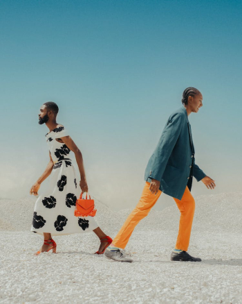 Man Wearing a Dress and Woman Wearing a Suit