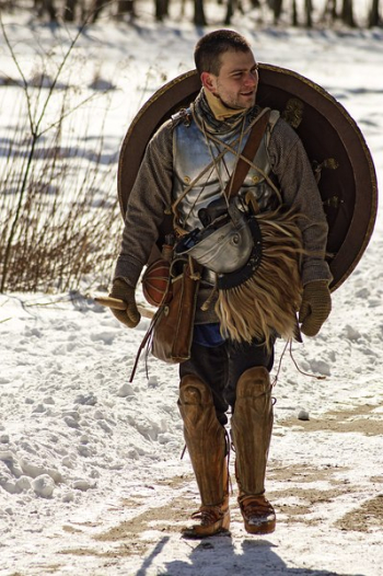 Man Wearing Armor and Walking in Snowy Field Man Wearing Armor and Walking in Snowy Field