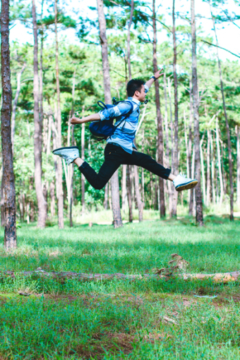 Man Wearing Backpack Jumping Photo Man Wearing Backpack Jumping Photo