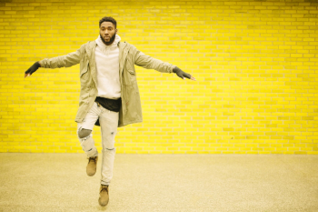 Man Wearing Beige Jacket and White Jeans Man Wearing Beige Jacket and White Jeans